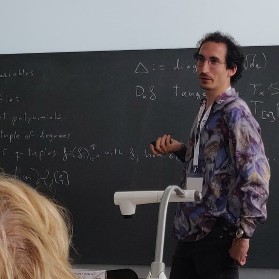 Josue Tonelli-Cueto giving a talk at the SIAM Conference on Applied Algebraic Geometry 2019
